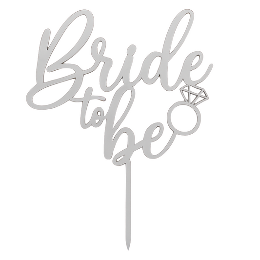 Silver 'Bride to be' cake topper with a diamond ring design on a white background