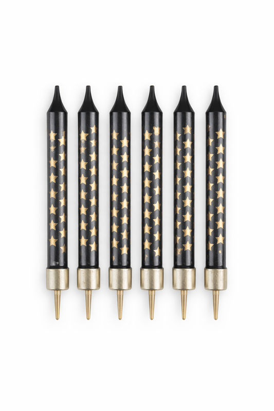Set of six black pens with gold star patterns on a white background