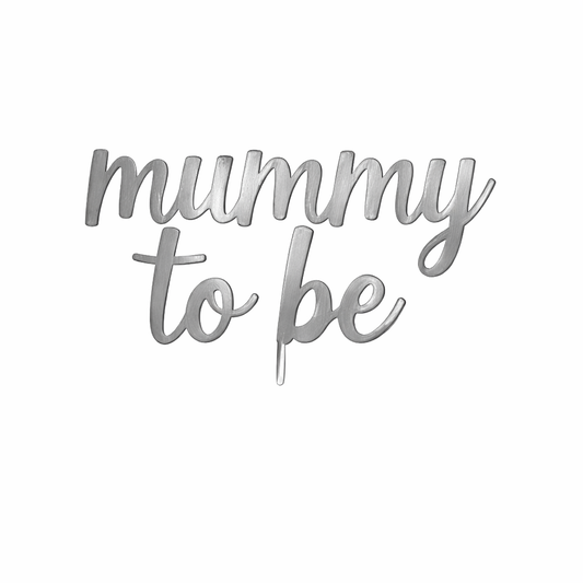 Silver 'mummy to be' cake topper on a white background