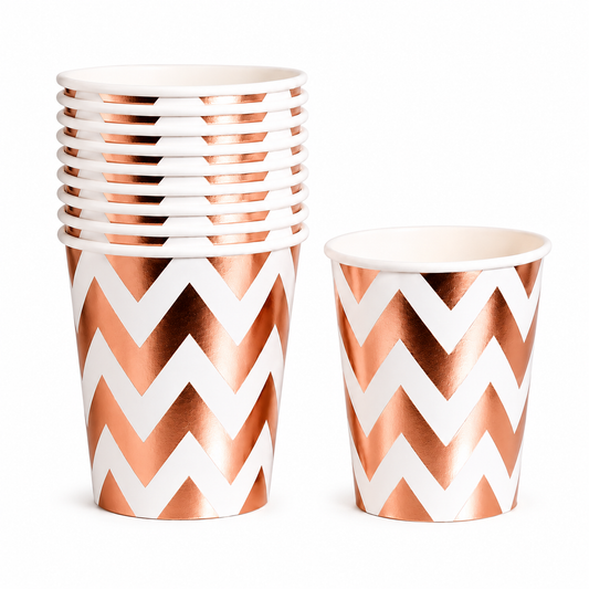 Set of paper cups with rose gold and white chevron pattern on a white background