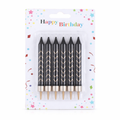 Set of black birthday candles with gold tips in packaging labeled 'Happy Birthday'.