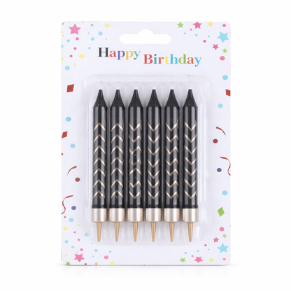 Set of black birthday candles with gold tips in packaging labeled 'Happy Birthday'.