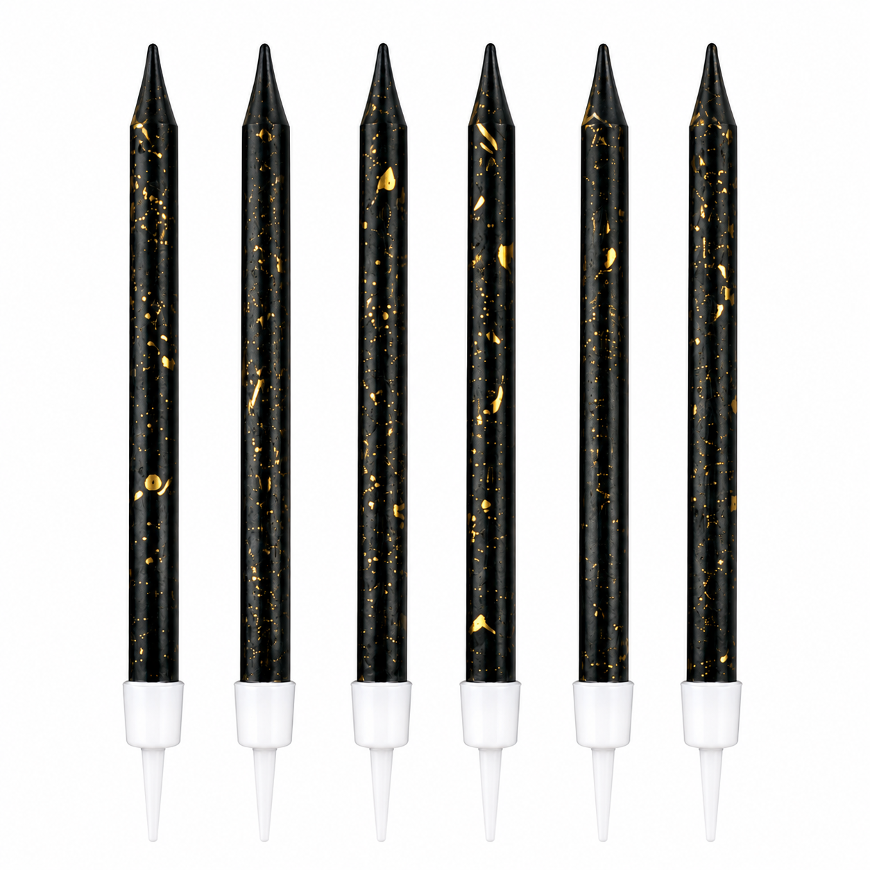 Set of six black candles with gold specks and white bases on a white background