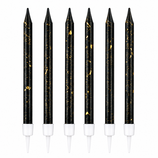 Set of six black candles with gold specks and white bases on a white background