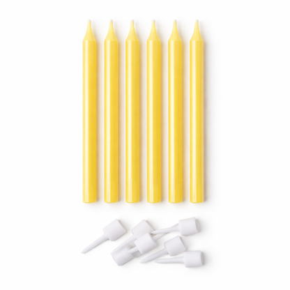 Set of yellow candles and white nozzles