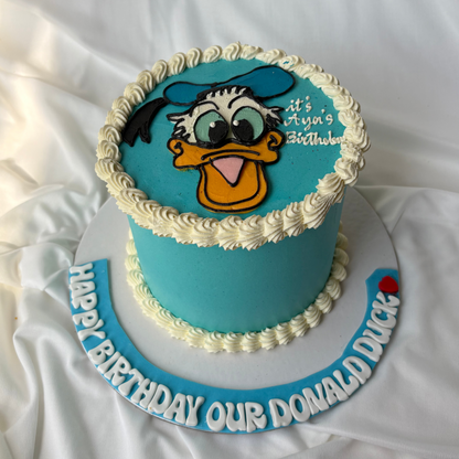Blue birthday cake with Donald Duck face on a white background
