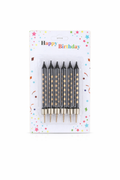 Set of black birthday candles with gold tips in packaging labeled 'Happy Birthday' on a white background