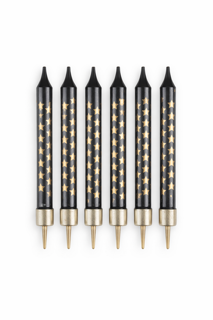 Set of six black pens with gold star patterns on a white background