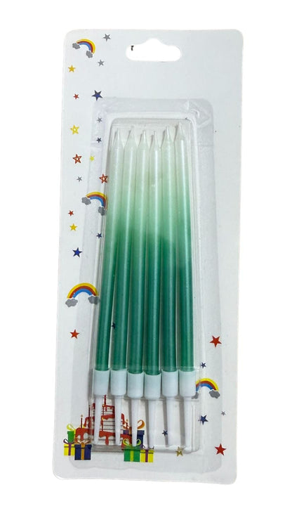 A set of ombre colored candles, with packaging that includes a pink and blue ombre design and a set of pink candles with a similar pattern.