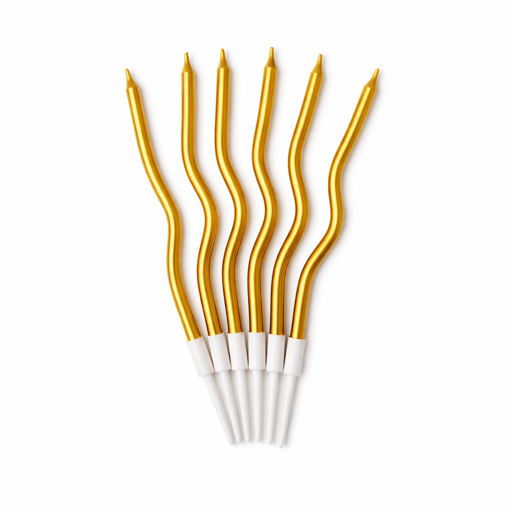 Set of gold cake candles with white bases on a white background