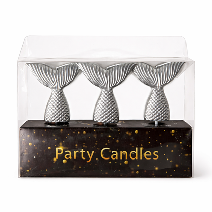 Three silver mermaid-tail shaped candles in a clear packaging box with 'Party Candles' text.