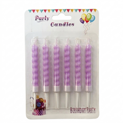 Pack of purple spiral birthday candles on a white background