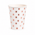 A white paper party cup decorated with a pattern of metallic rose gold polka dots, shown on a clean white background.