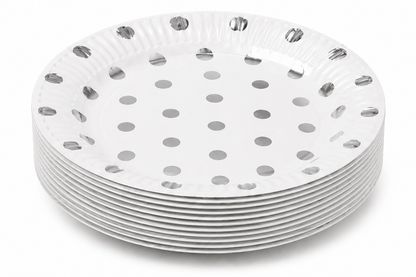 Stack of metallic polka dot paper plates on deep white background