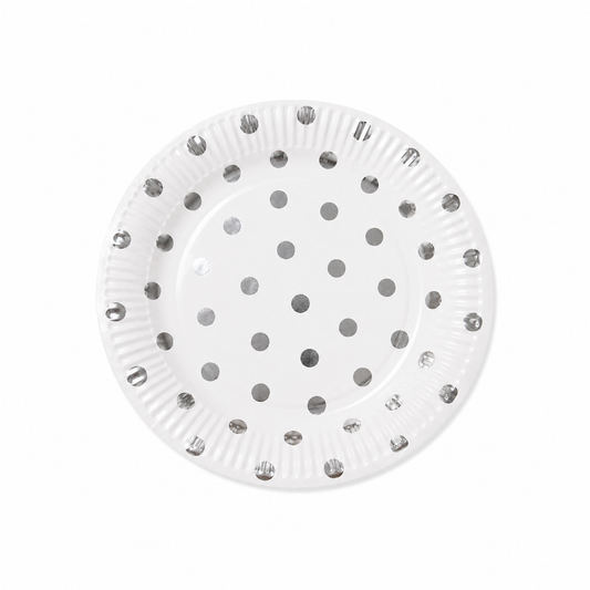 White paper plate with metallic silver polka dot design on white background