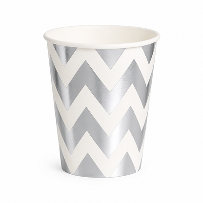Paper cup with silver and white chevron pattern on a white background