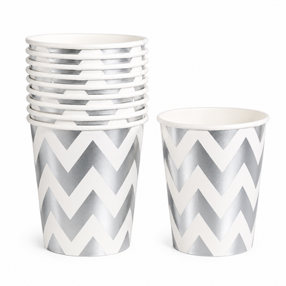 Set of paper cups with silver and white chevron pattern on a white background