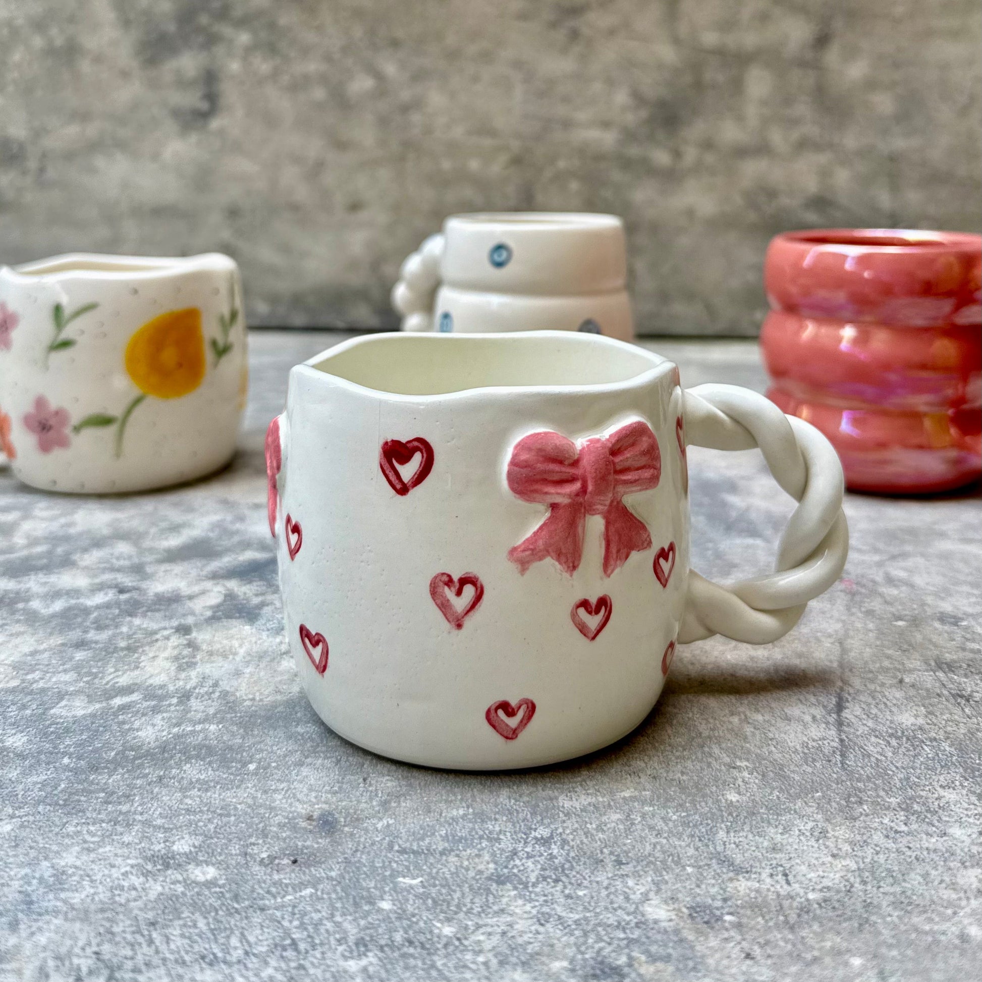 Sweetheart Sips mug with pink bow and red hearts