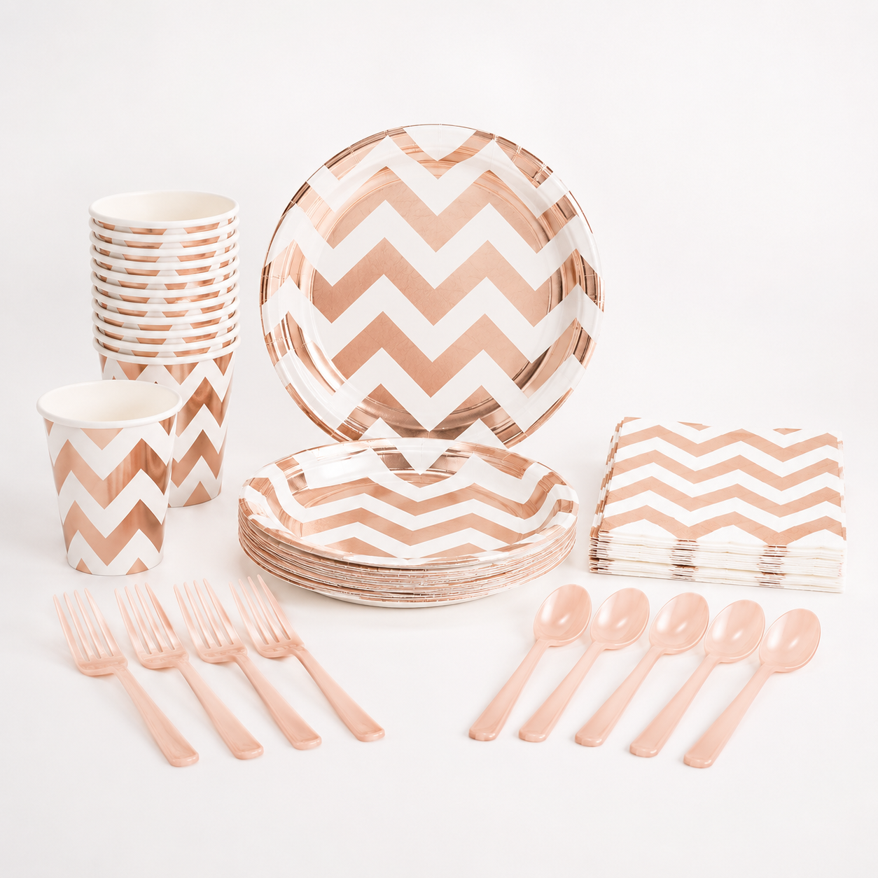 Party supplies with rose gold chevron pattern on a white background