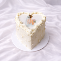 Wedding-themed cake with a bride and groom on a white background