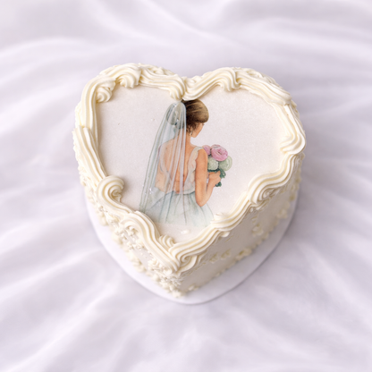 Decorative heart-shaped box with a bride illustration on a white background