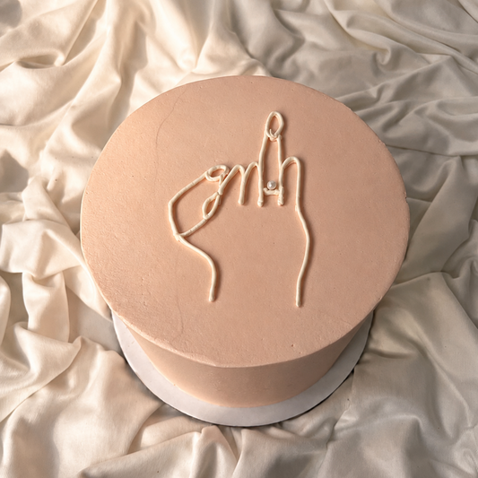 Round beige object with a hand gesture design on a textured beige surface