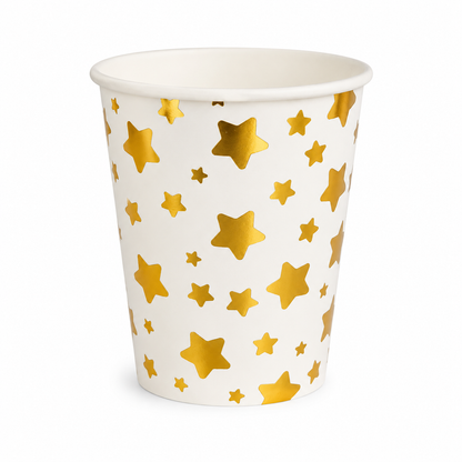 White paper cup with gold star pattern on a white background