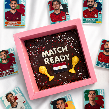 Chocolate brownies with 'Match Ready' text and Egypt flag, surrounded by football player cards.