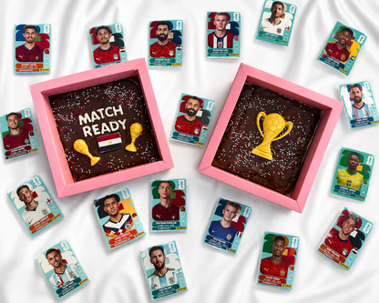 Collection of football player cookies with two chocolate brownies featuring trophy designs on a white background.