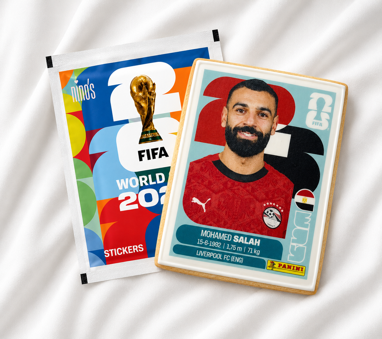 FIFA World Cup 2022 stickers with a player card featuring Mohamed Salah on a white background.