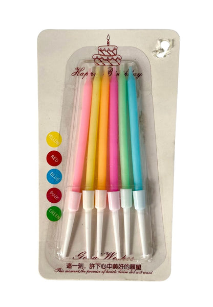 A pack of mini rainbow colored candles, each candle is individually wrapped in brightly colored wax with a label at the bottom saying 'Rainbow Colors'. The packaging is clear and allows visibility of the candles.