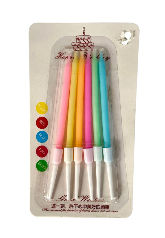 A pack of mini rainbow colored candles, each candle is individually wrapped in brightly colored wax with a label at the bottom saying 'Rainbow Colors'. The packaging is clear and allows visibility of the candles.